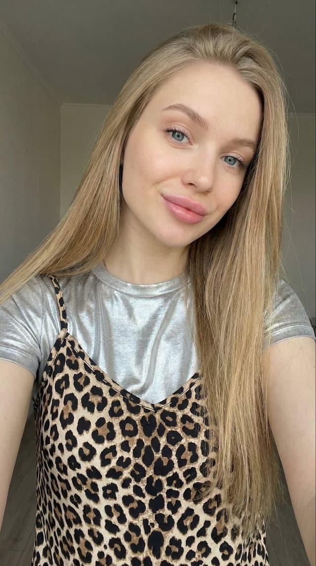 Profile / Avatar - Close-up Selfie of a Young Woman with Leopard Print Top — output
