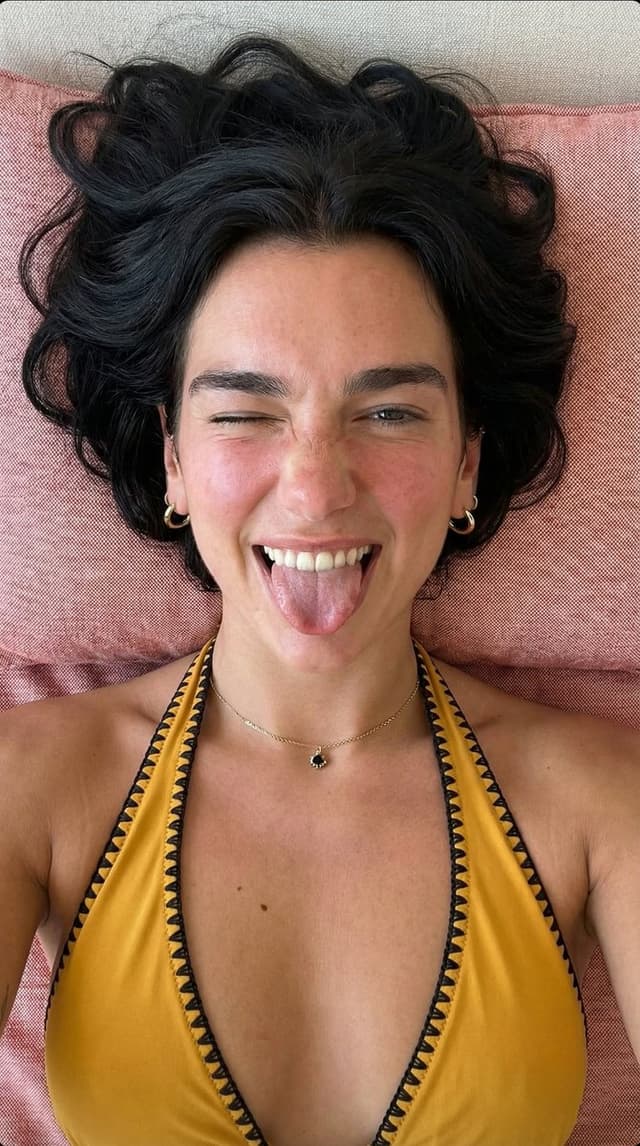 Playful Overhead Portrait with Winking Expression Prompt (Black Hair) — output
